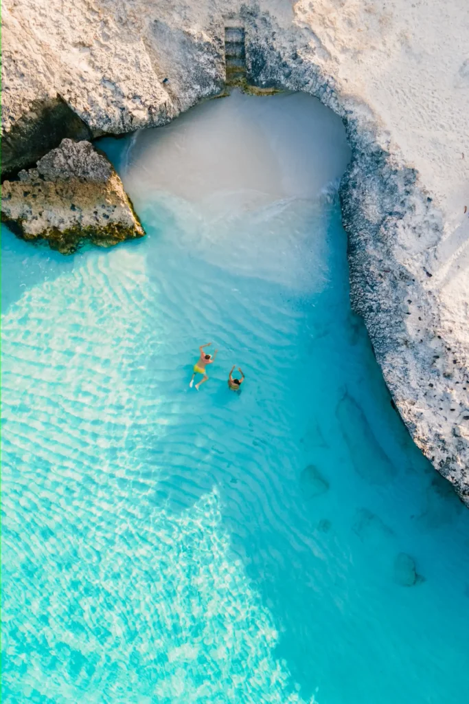Swimmers in a turquoise lagoon in Aruba