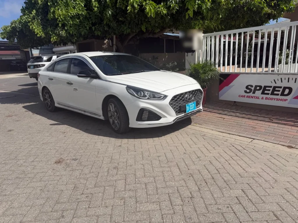 Hyundai Sonata parked at the Speed Car Rental office in Tanki Leendert, Aruba