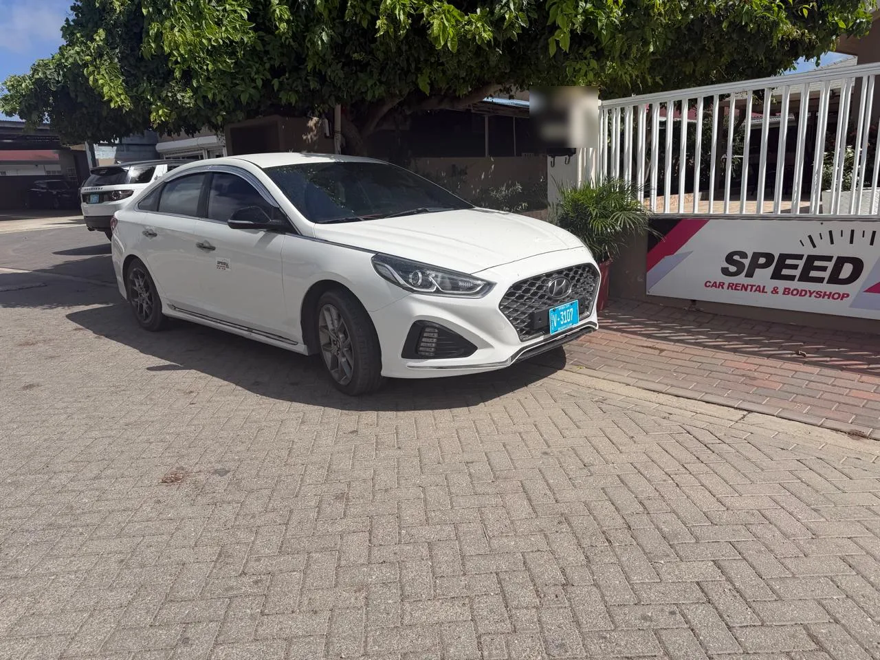 Hyundai Sonata parked at the Speed Car Rental office in Tanki Leendert, Aruba