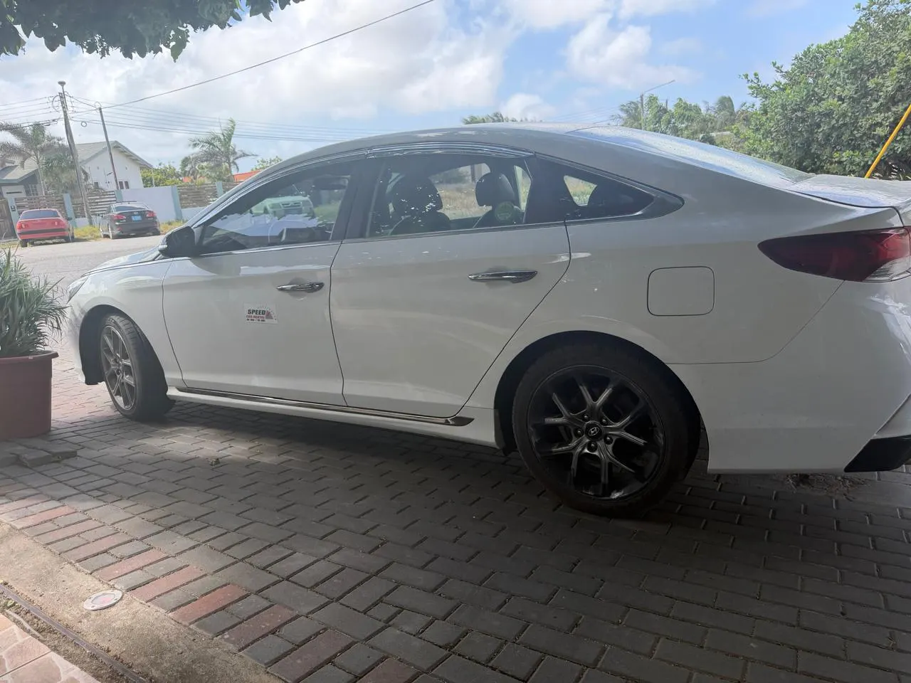 White Hyundai Sonata from Speed Car Rental Aruba, side view