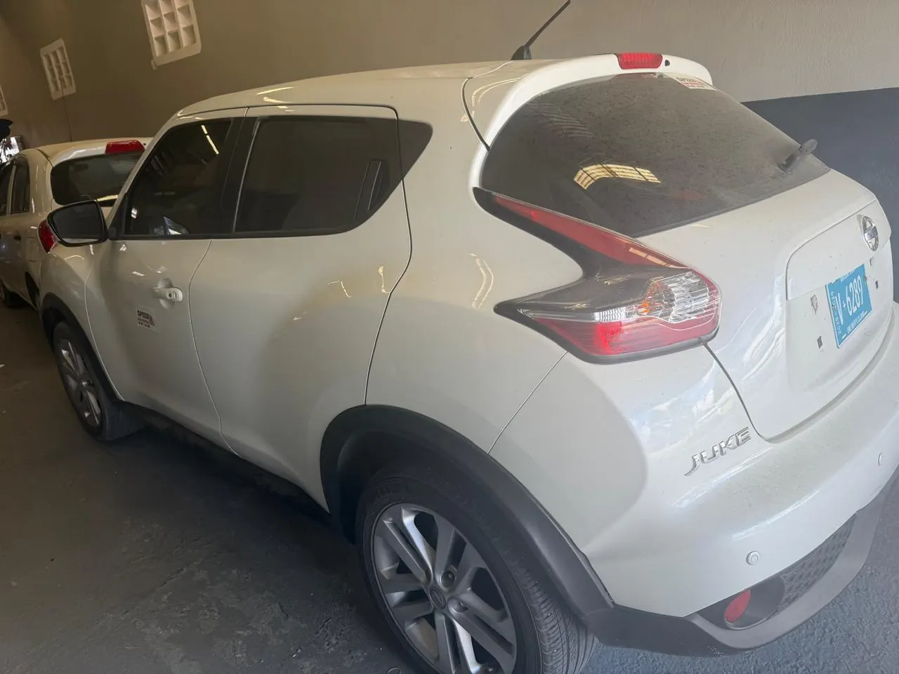 White Nissan Juke from Speed Car Rental Aruba, rear view