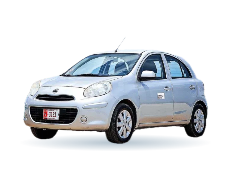Silver Nissan March rental car in Aruba