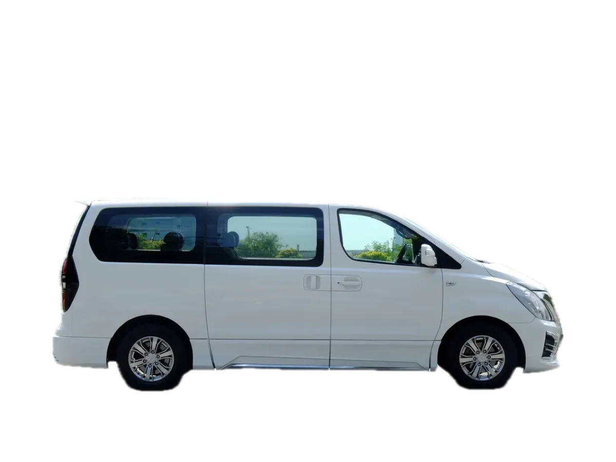 White Hyundai Starex 12-seat van rental in Aruba